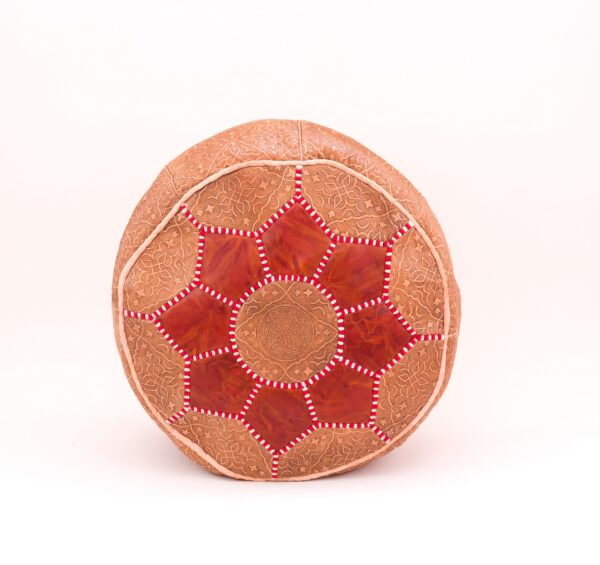 leather pouf with a touch of red