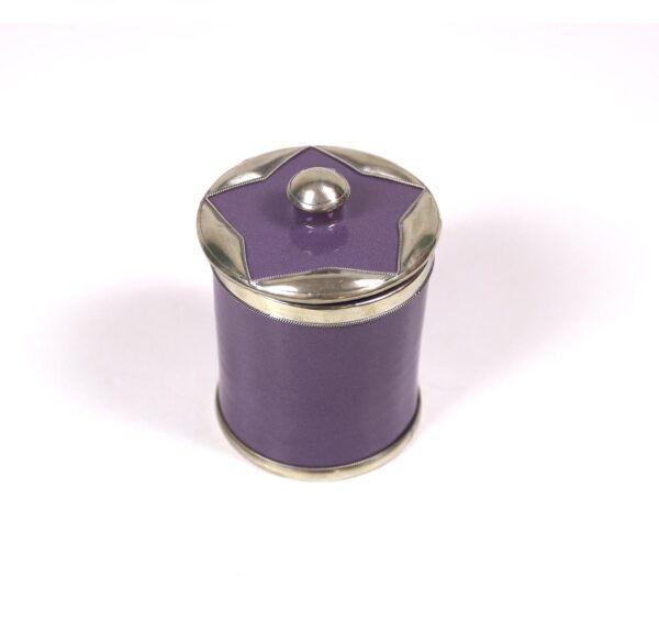 enamelled pottery box surrounded by silver metal