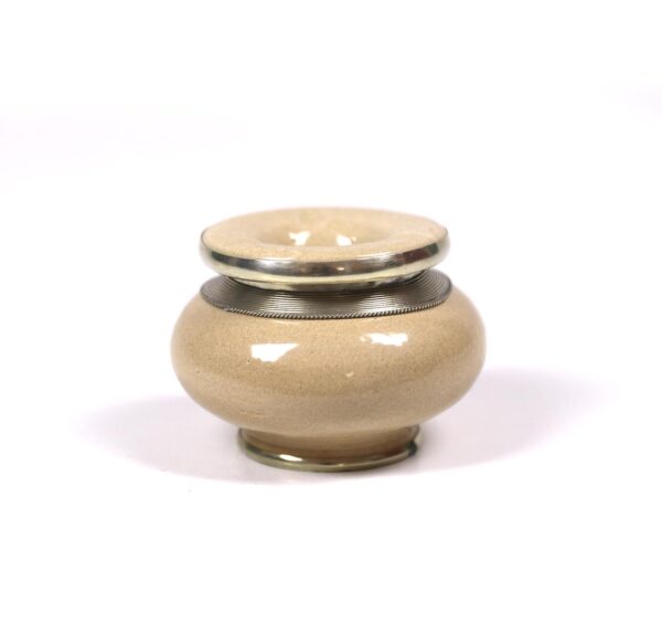 Pottery ashtray, oval,surrounded by silver metal